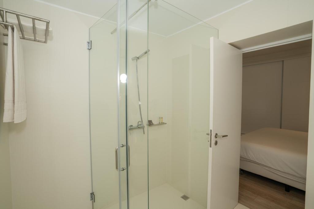 Postel nebo postele na pokoji v ubytování Dune Beach CoLiving