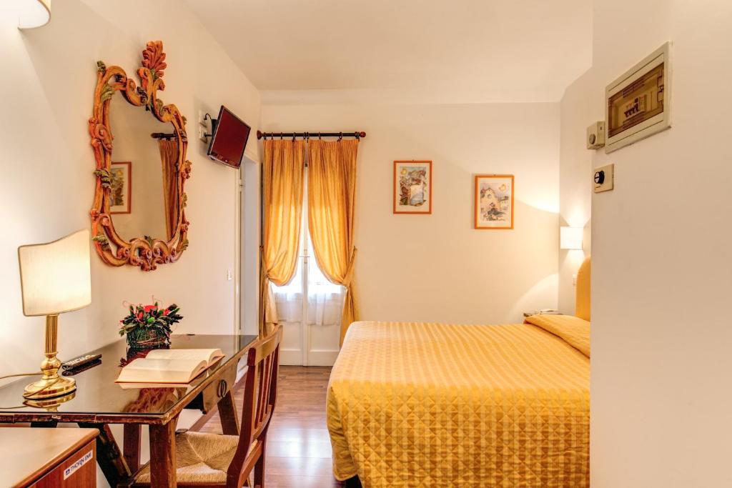 A bed or beds in a room at Hotel S.Giorgio & Olimpic