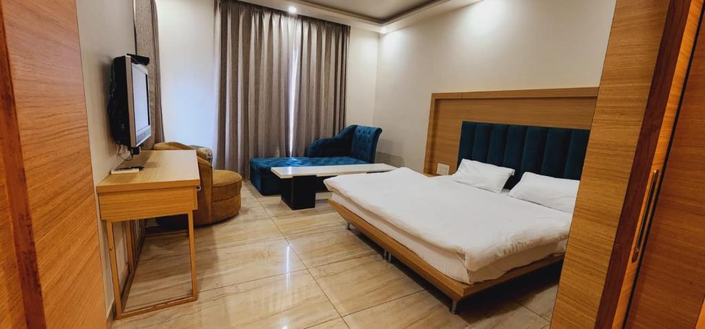 Postel nebo postele na pokoji v ubytování Hotel Amar Palace