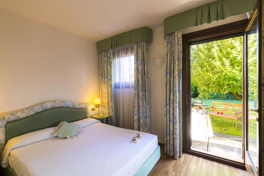 Cama o camas de una habitación en Relais Leon d'Oro