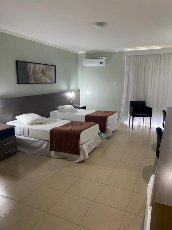 Postel nebo postele na pokoji v ubytování Class Hotel Passos Rio Grande Portal da Canastra