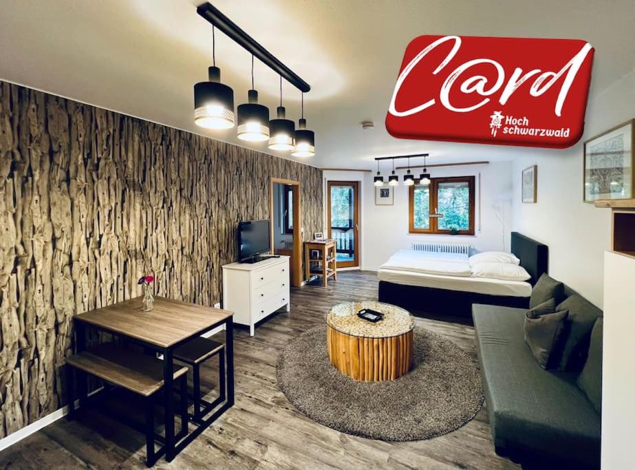a living room with a couch and a coffee table at Waldtwin 1 Titisee (W11) + Hochschwarzwald Card in Titisee-Neustadt