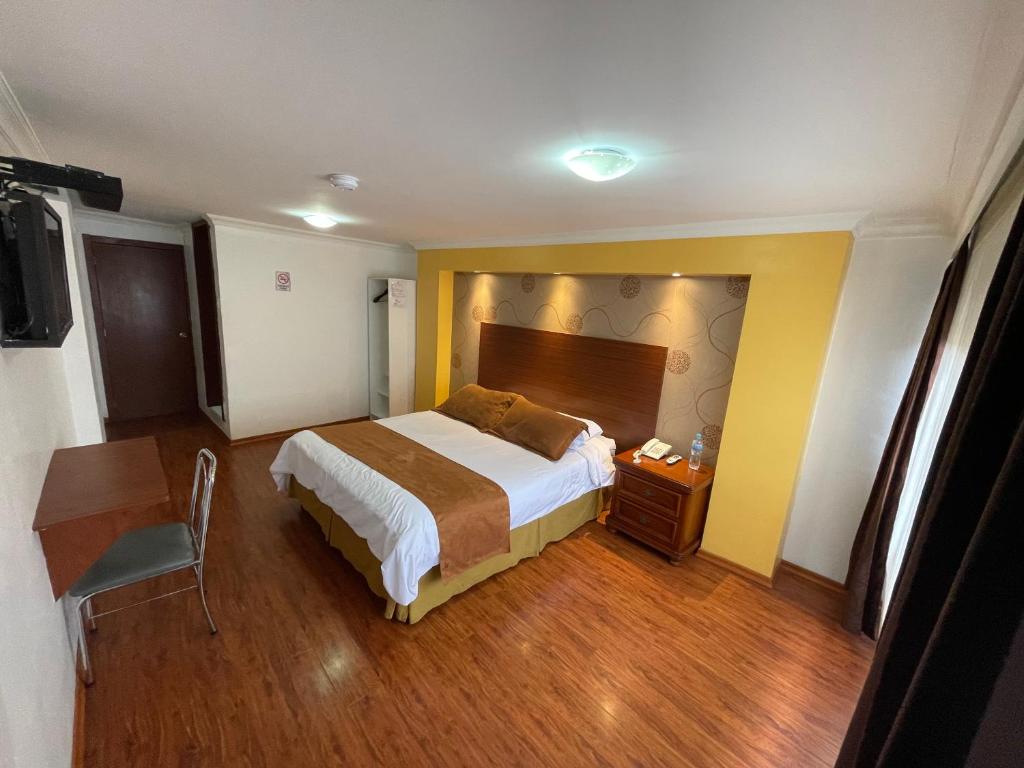 Postel nebo postele na pokoji v ubytování Gran Hotel Napoleón