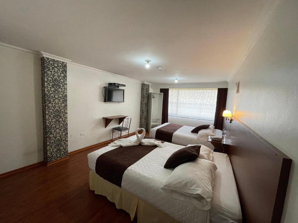 Postel nebo postele na pokoji v ubytování Gran Hotel Napoleón
