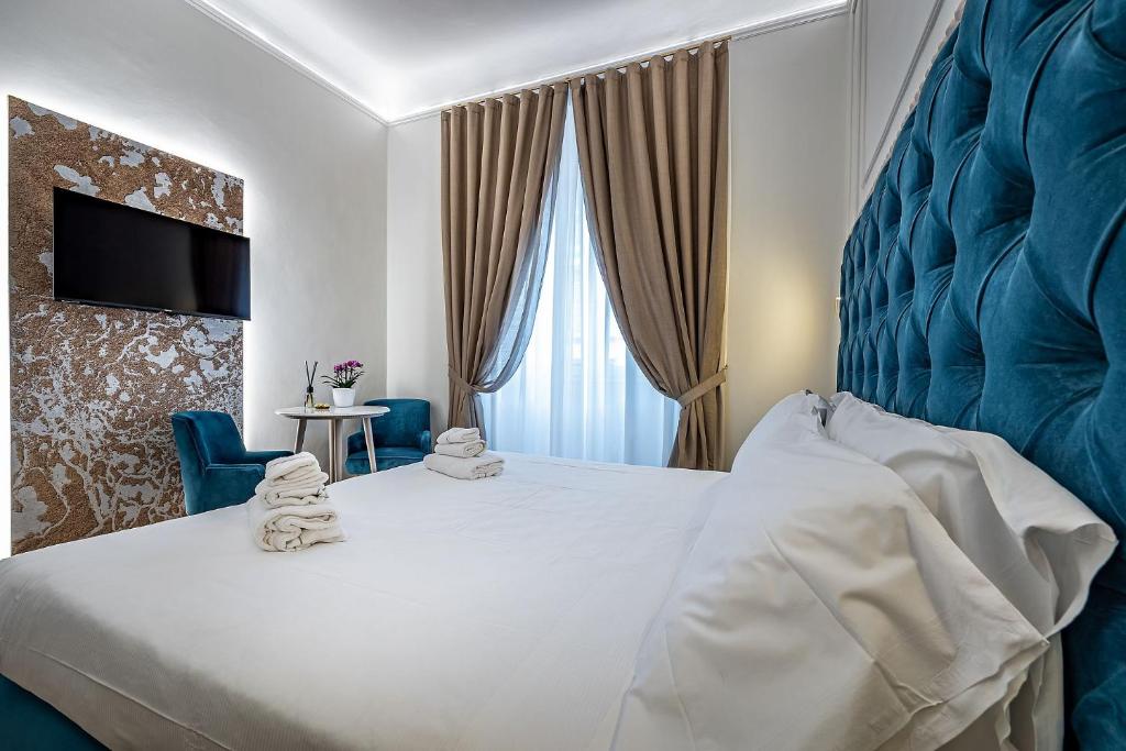 A bed or beds in a room at Residenza Giotto