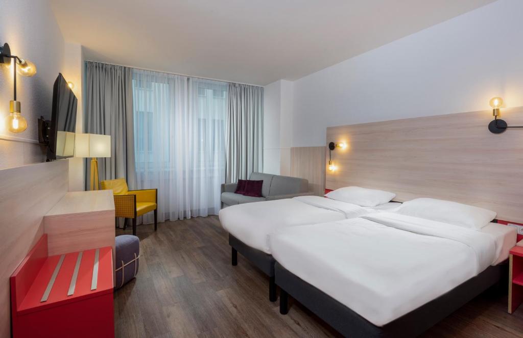Postel nebo postele na pokoji v ubytování greet Berlin Alexanderplatz