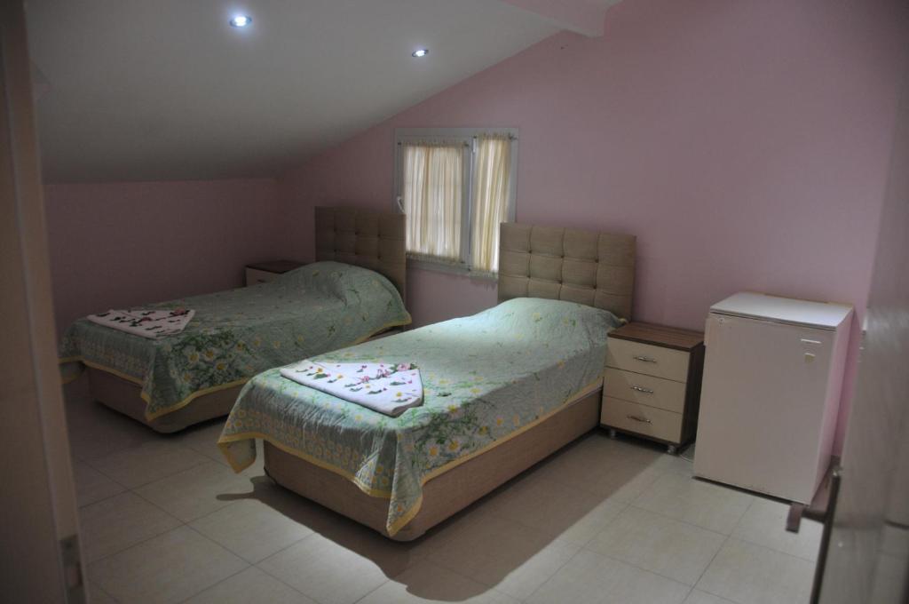 Postel nebo postele na pokoji v ubytování Tolay Hotel