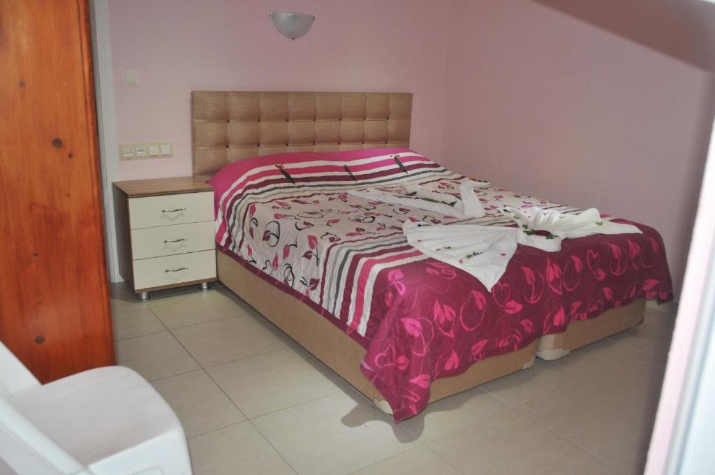 Postel nebo postele na pokoji v ubytování Tolay Hotel