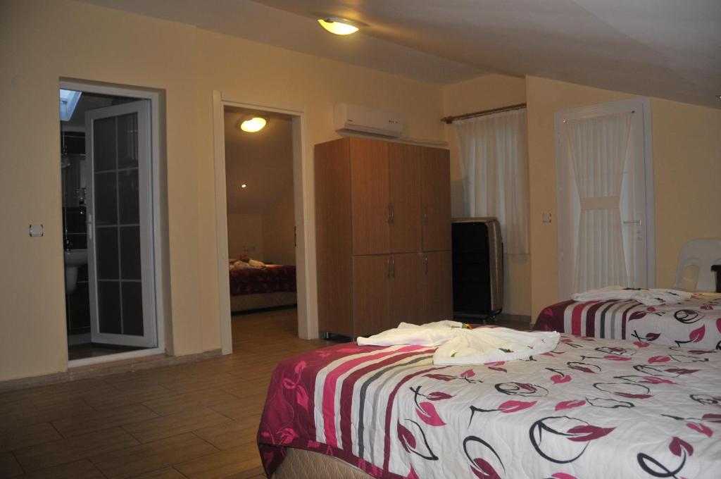 Postel nebo postele na pokoji v ubytování Tolay Hotel