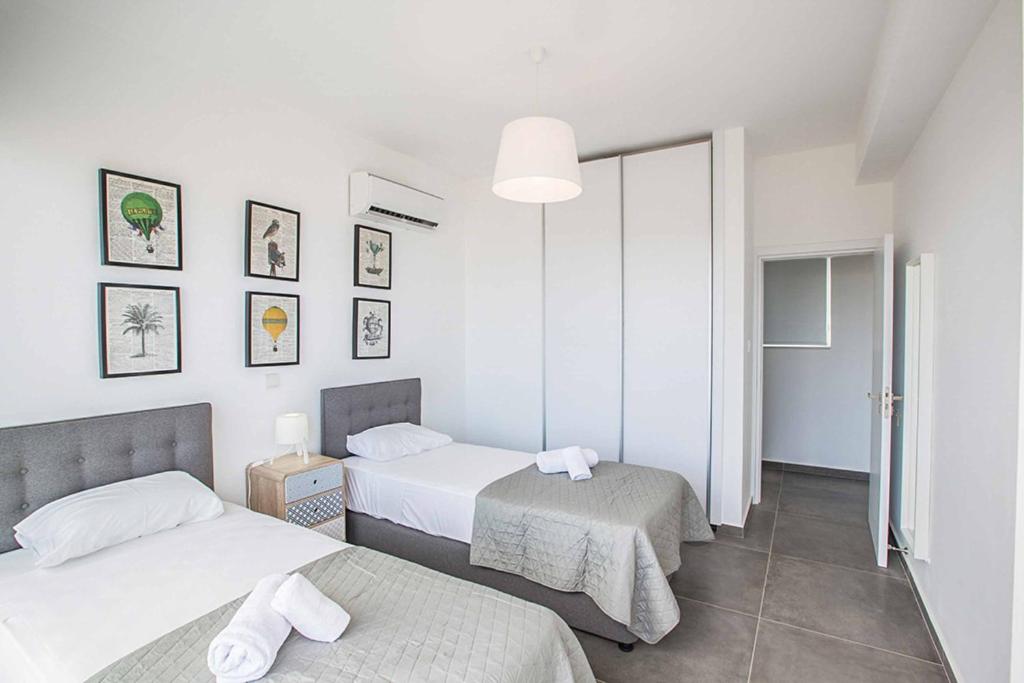Postel nebo postele na pokoji v ubytování Villa Olivine Pearl 6