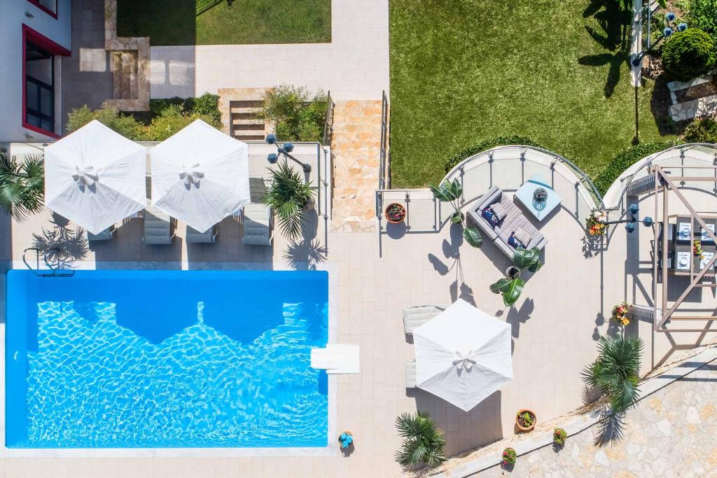The swimming pool at or close to Villa Alexandra Karvouno Villas