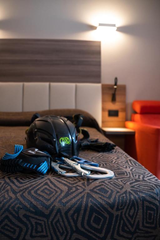 Postel nebo postele na pokoji v ubytování Hotel Ciclamino