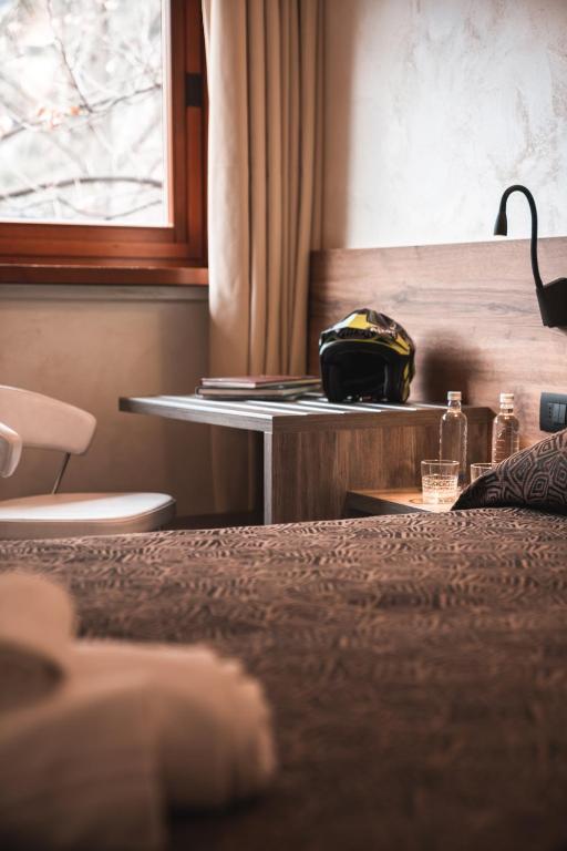 Postel nebo postele na pokoji v ubytování Hotel Ciclamino