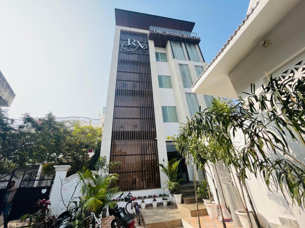 a building with a bike on the side of it at HOTEL THE ROYAL VISTA in Varanasi