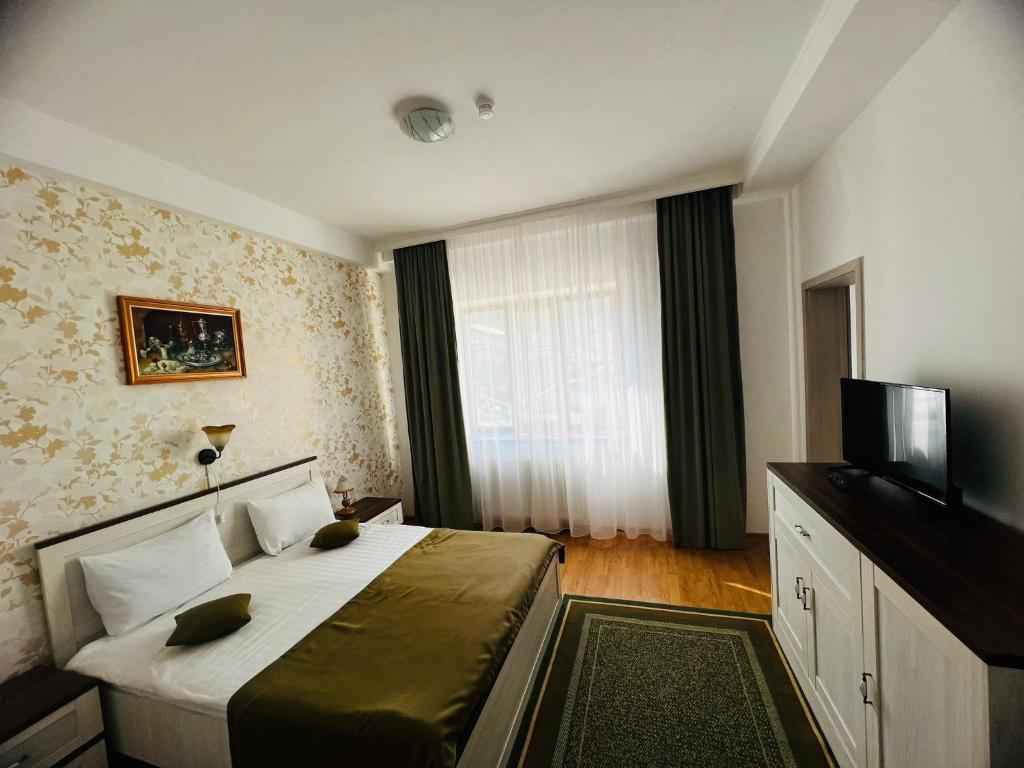 TV a/nebo společenská místnost v ubytování Hotel Suprem