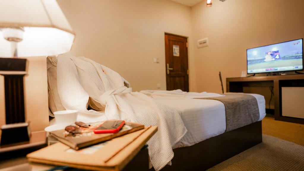 Postel nebo postele na pokoji v ubytování Royal Classic Resort