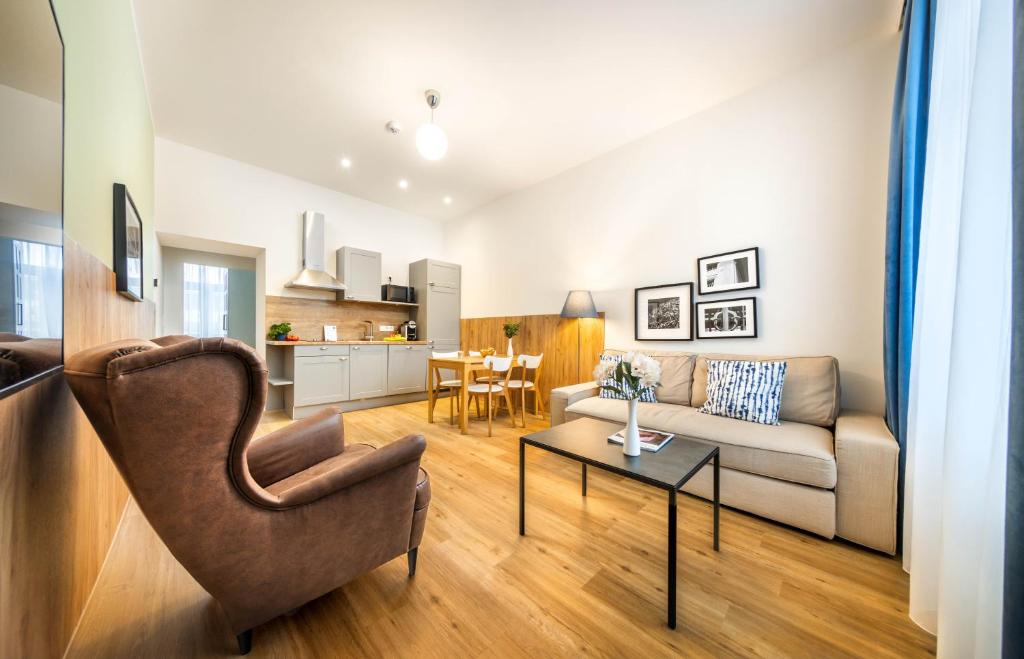 a living room with a couch and a table at Jimmy's Apartments Emerald in Vienna