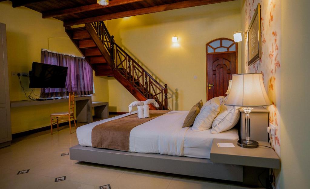 Postel nebo postele na pokoji v ubytování Royal Classic Resort