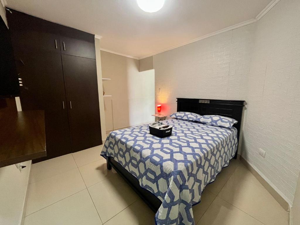 Ένα ή περισσότερα κρεβάτια σε δωμάτιο στο Suite Junior Urdesa Central.