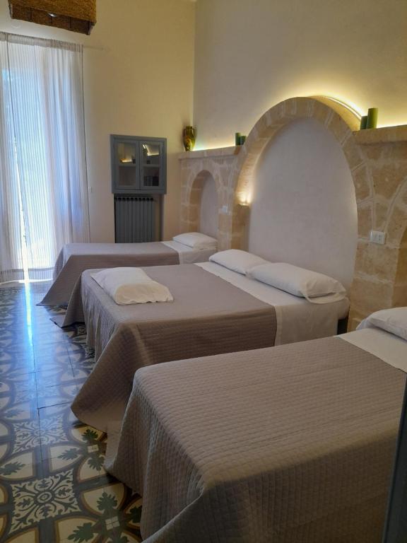 Postel nebo postele na pokoji v ubytování Masseria Don Sante
