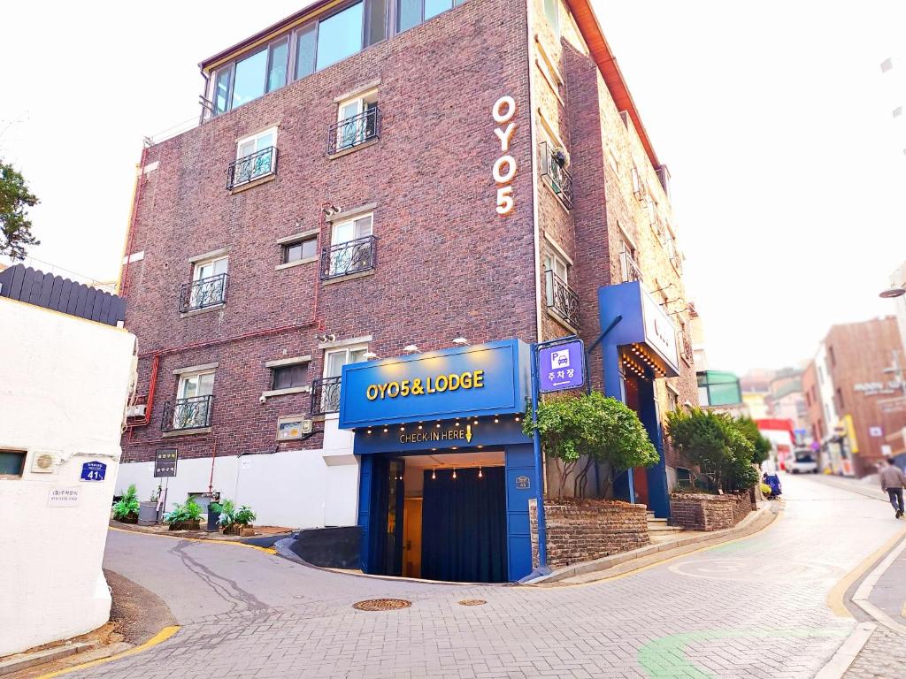 a building on a street with a sign that reads unavailable at OYO Hostel Myeongdong 5 in Seoul