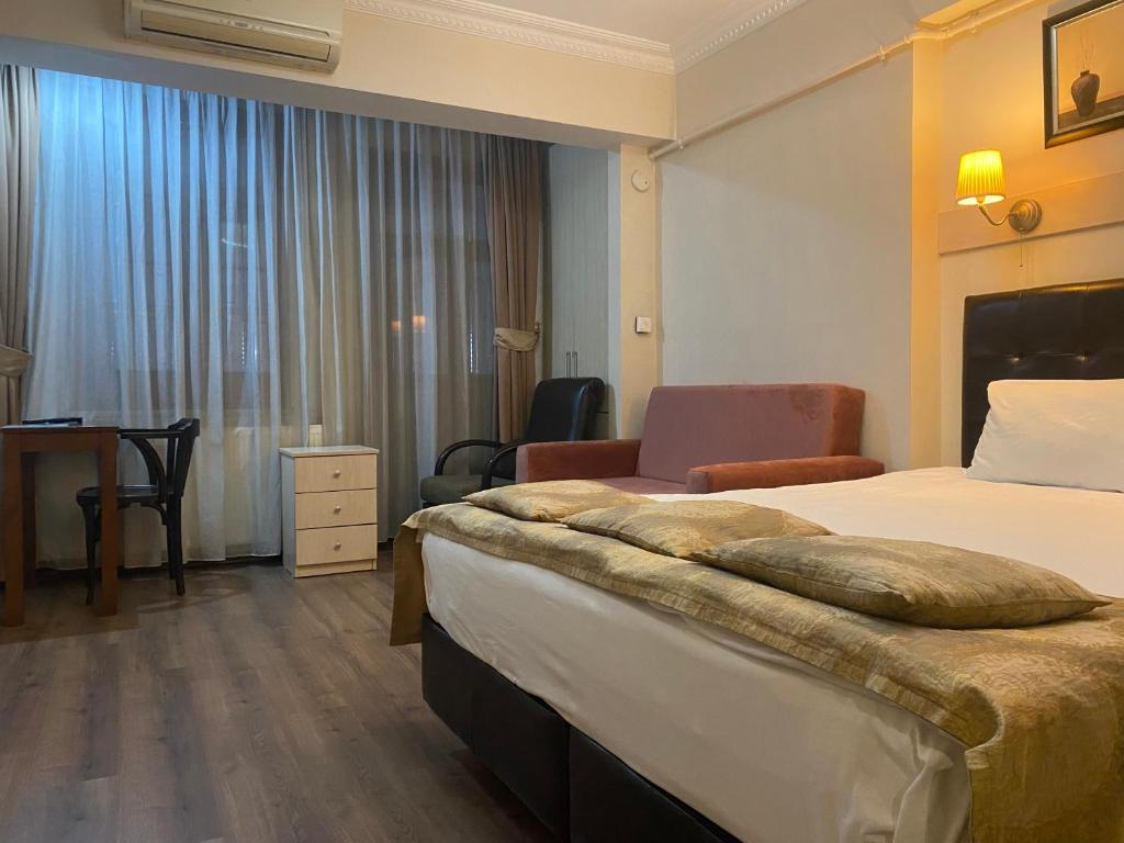 Postel nebo postele na pokoji v ubytování Taksim House Suites