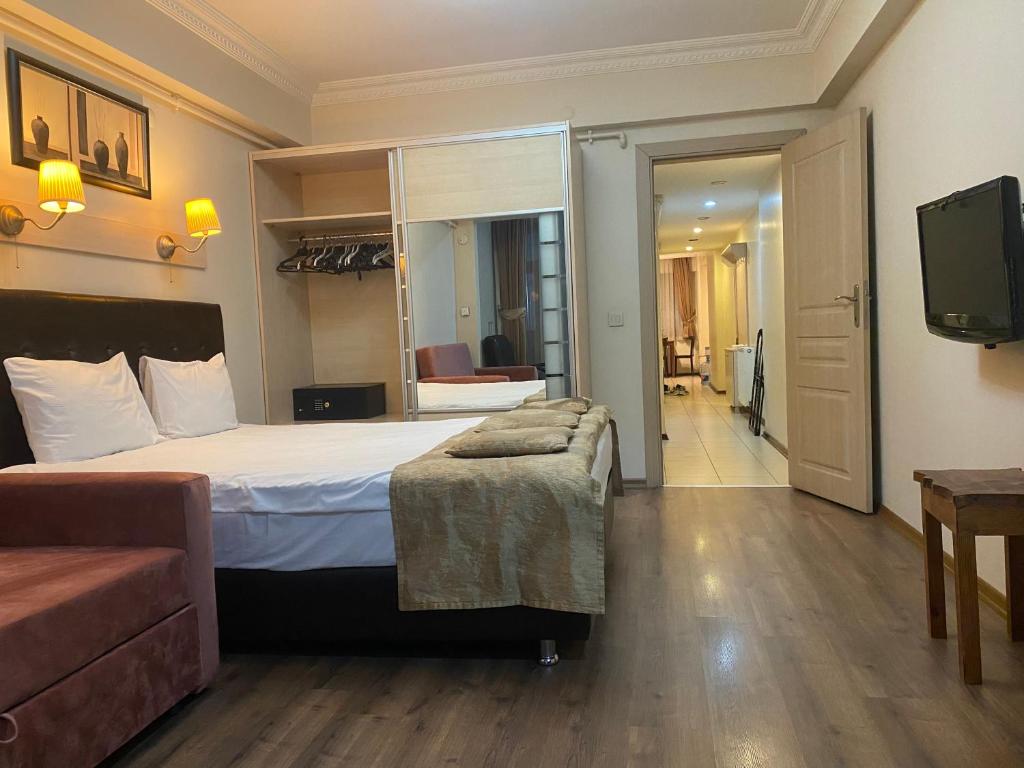 Postel nebo postele na pokoji v ubytování Taksim House Suites