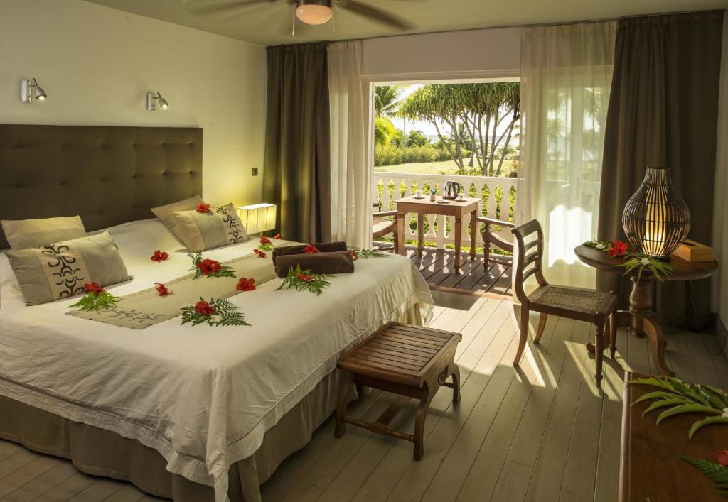 Postel nebo postele na pokoji v ubytování Raiatea Lodge Hotel