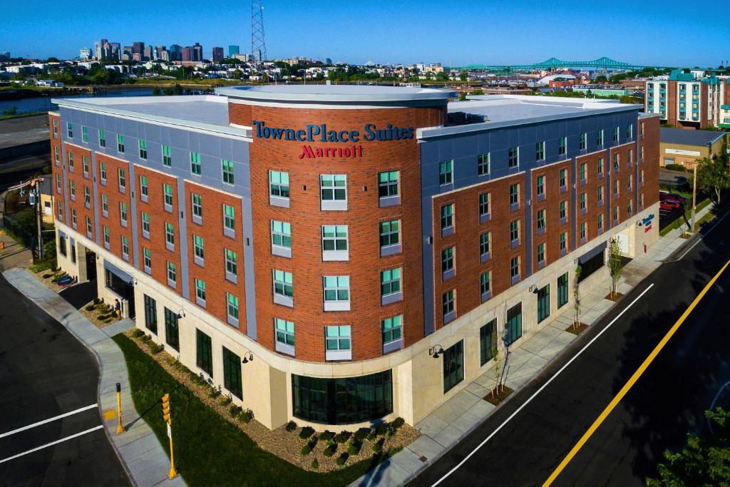 a large red brick building with a sign on it at TownePlace Suites by Marriott Boston Logan Airport/Chelsea in Chelsea