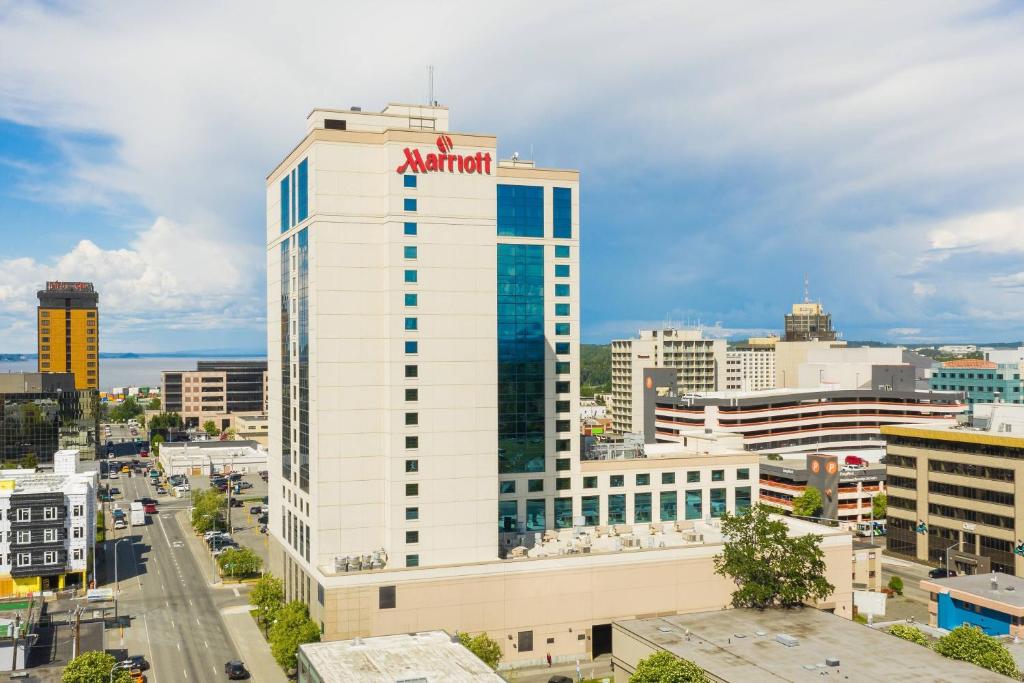 a tall white building with aania on top of it at Marriott Anchorage Downtown in Anchorage