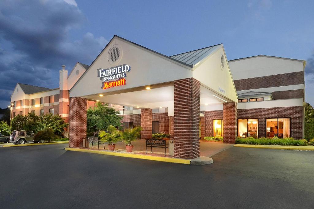 a hotel with a sign on the front of it at Fairfield by Marriott Inn & Suites Charlottesville North in Charlottesville