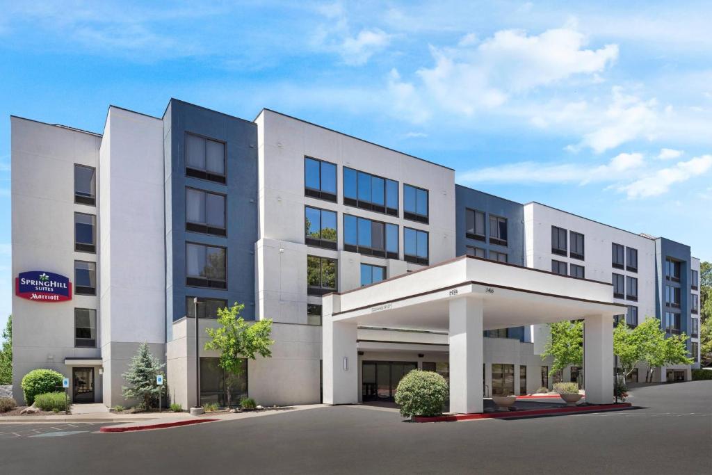 an office building with a large white building at SpringHill Suites by Marriott Flagstaff in Flagstaff