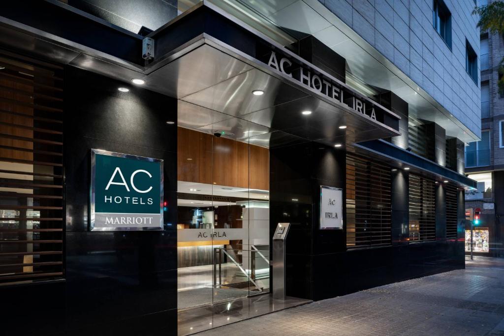 a store front with aac hotels sign on a building at AC Hotel Irla by Marriott in Barcelona