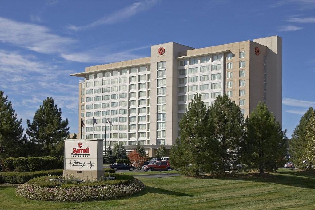 a large building with a sign in front of it at Auburn Hills Marriott Pontiac in Pontiac