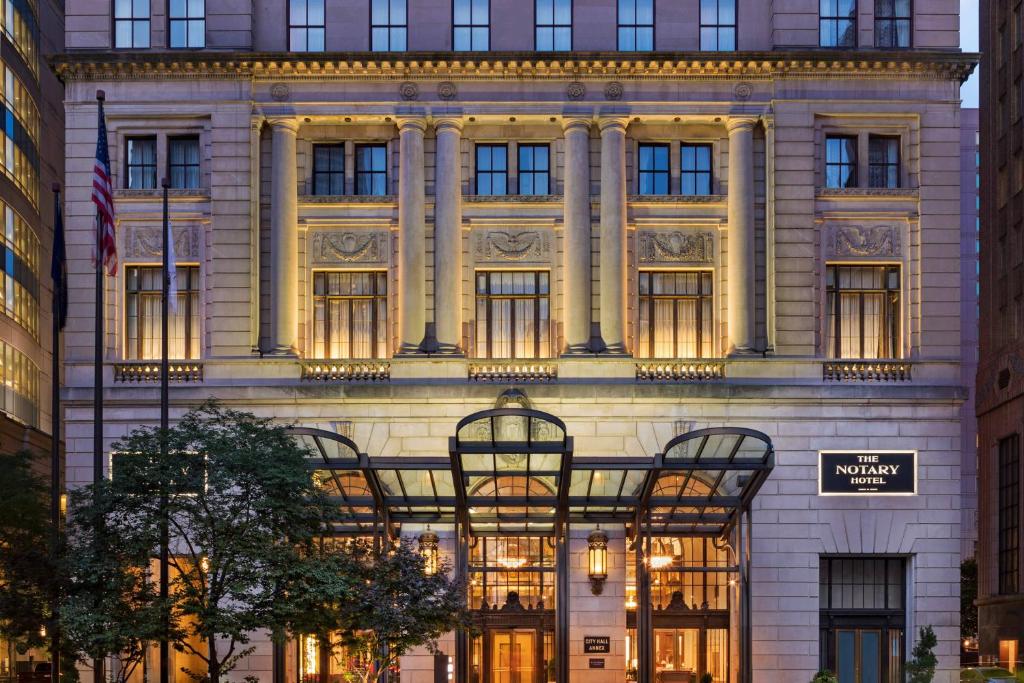 a building with two chairs in front of it at The Notary Hotel, Philadelphia, Autograph Collection in Philadelphia