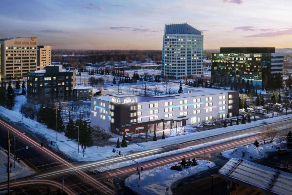 a view of a city with buildings and traffic at Aloft Anchorage in Anchorage