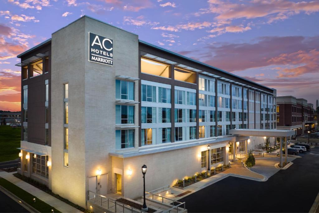 an mgm hotel with a sunset in the background at AC Hotel by Marriott Jackson Ridgeland in Ridgeland