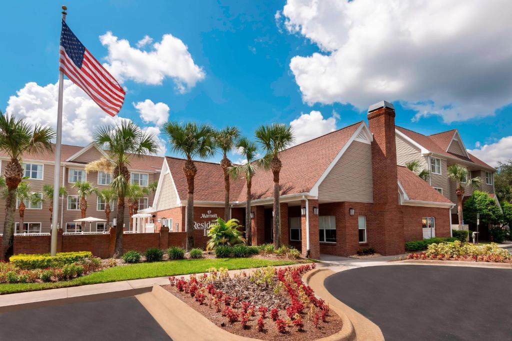 a hotel with an american flag in front of a building at Residence Inn by Marriott Tampa at USF/Medical Center in Tampa