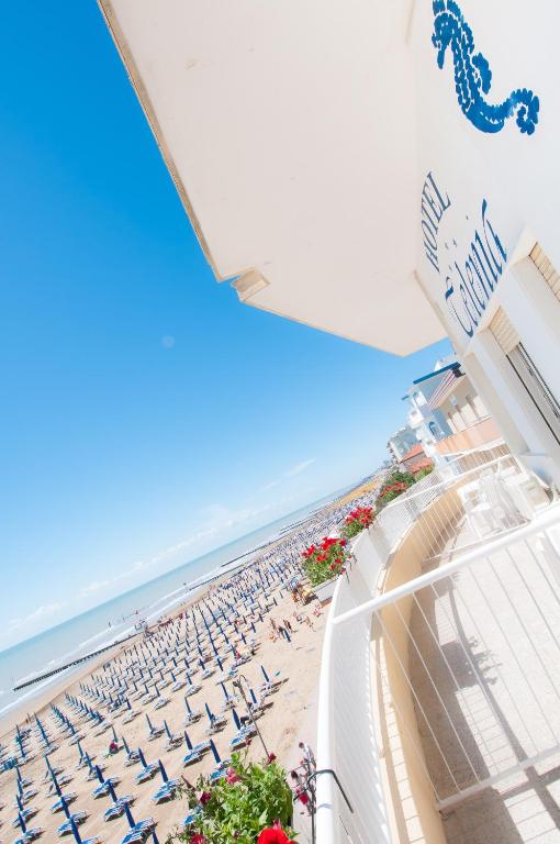 a view of the beach from the balcony of a resort at Hotel Telenia in Lido di Jesolo