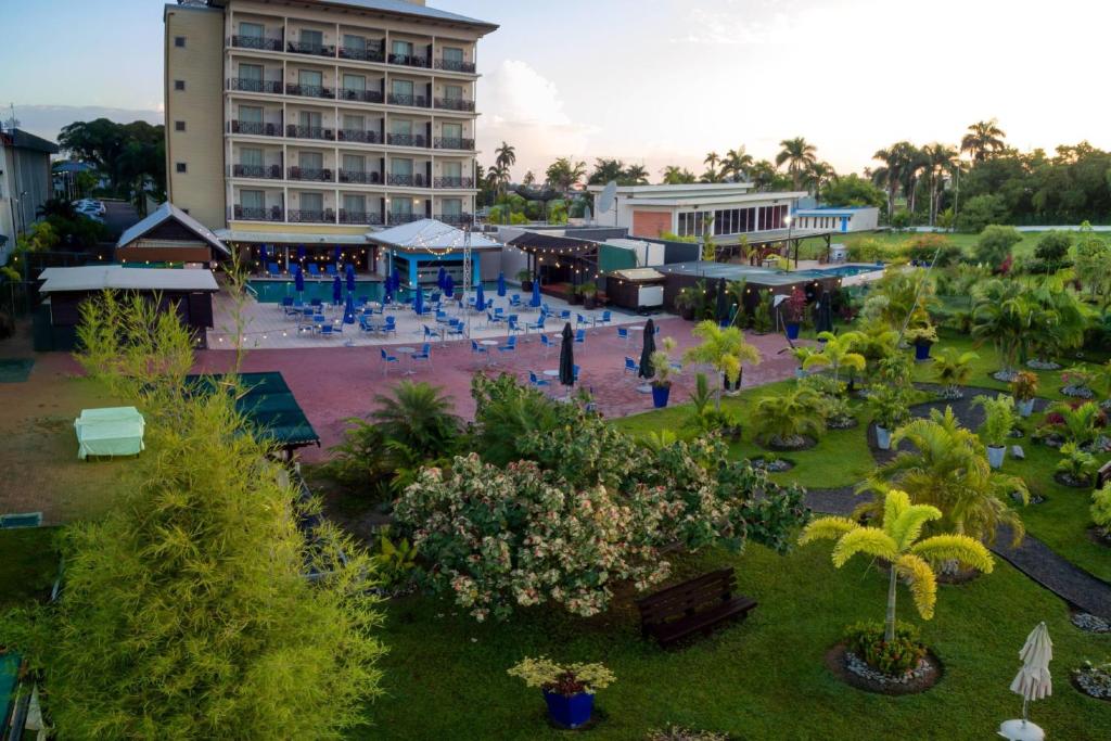 an aerial view of a resort with a building at Courtyard by Marriott Paramaribo in Paramaribo