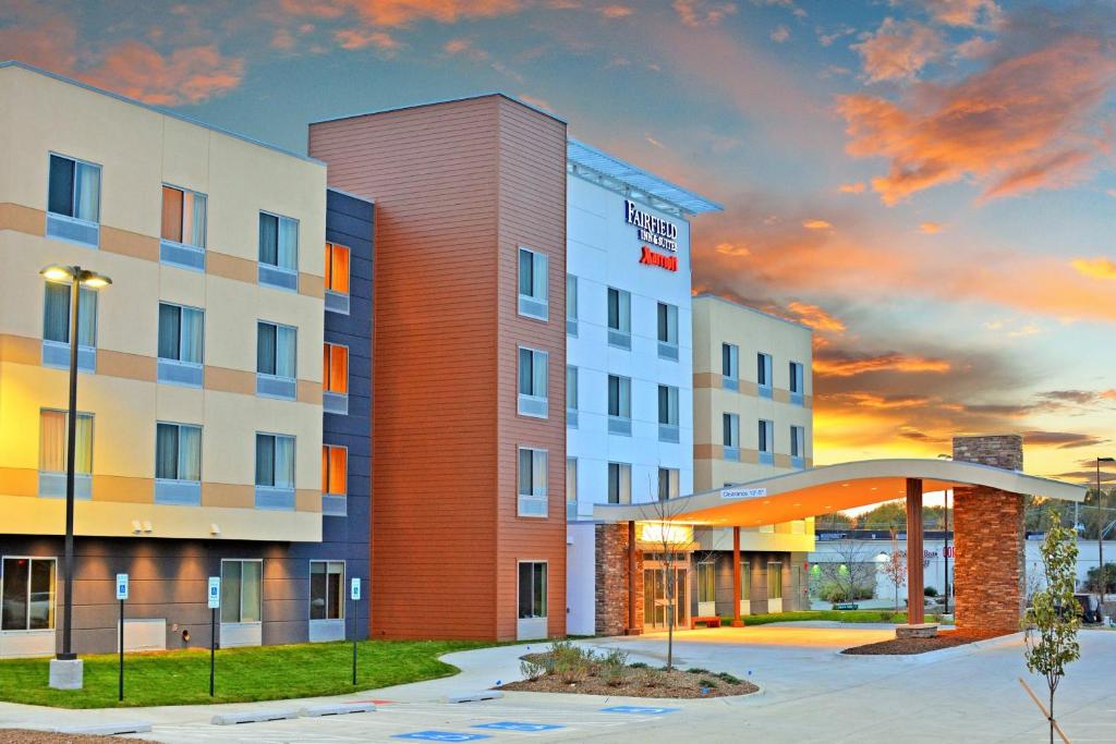 a rendering of a hotel with a sunset in the background at Fairfield Inn & Suites by Marriott Omaha Northwest in Omaha