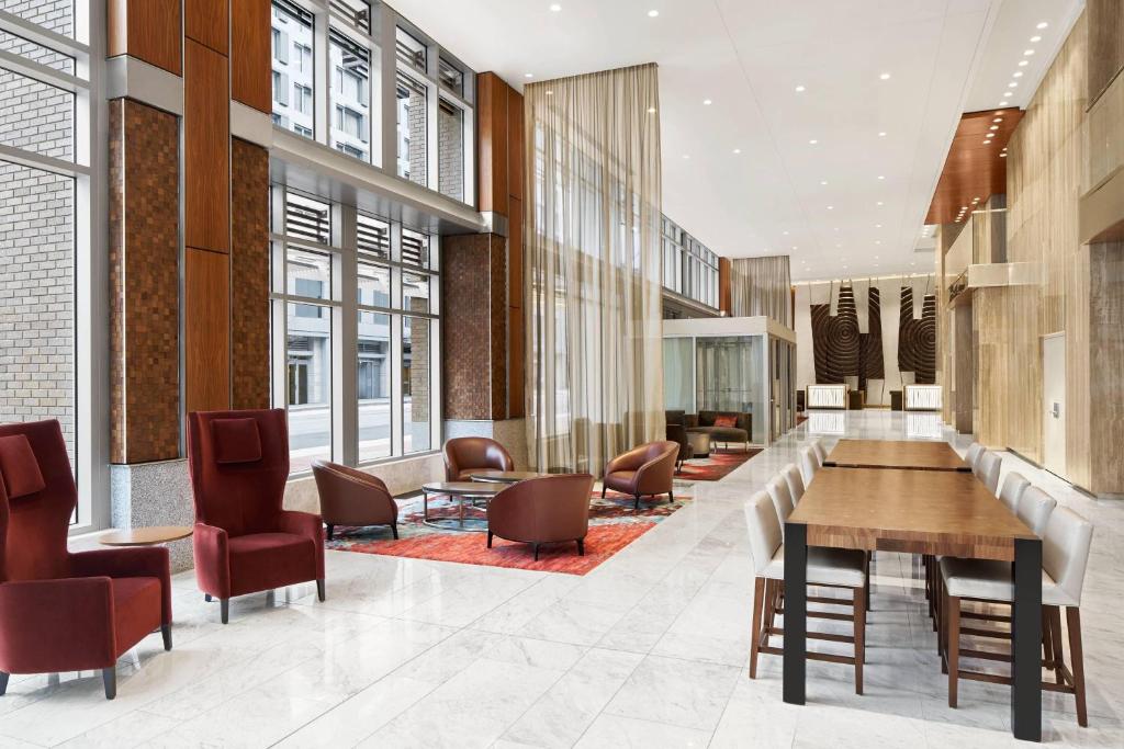 a lobby with a table and chairs in a building at Residence Inn by Marriott Washington Downtown/Convention Center in Washington