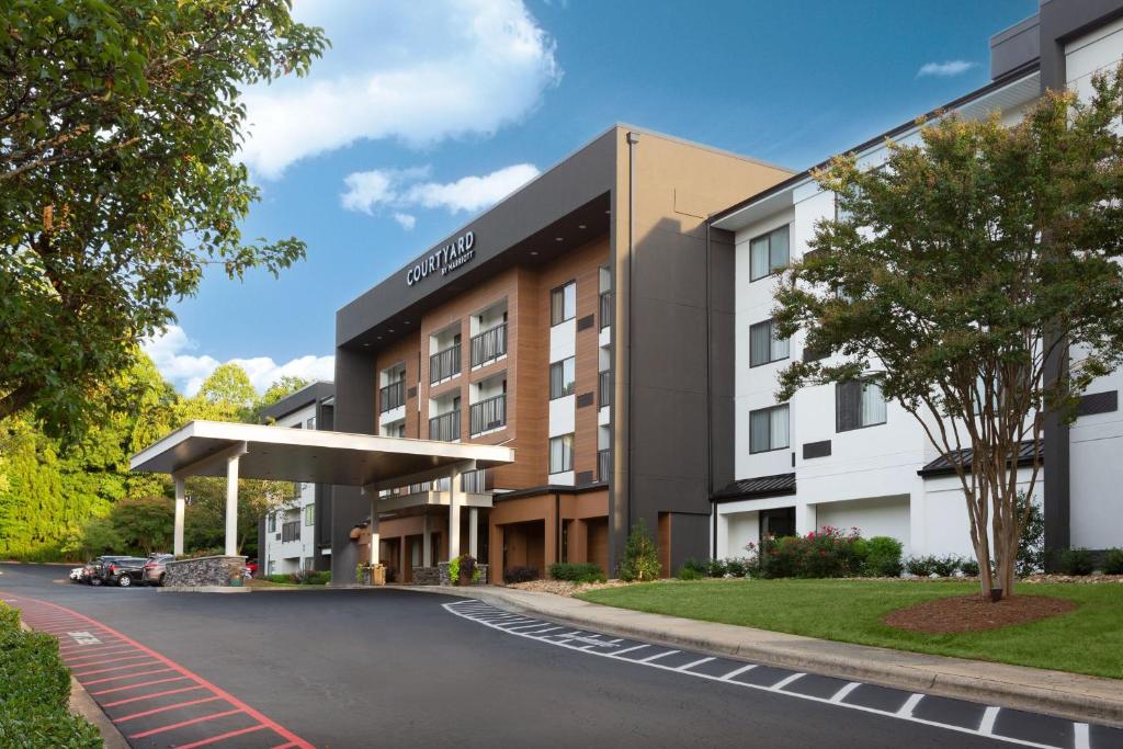 a rendering of the exterior of a hotel at Courtyard Winston-Salem Hanes Mall in Winston-Salem
