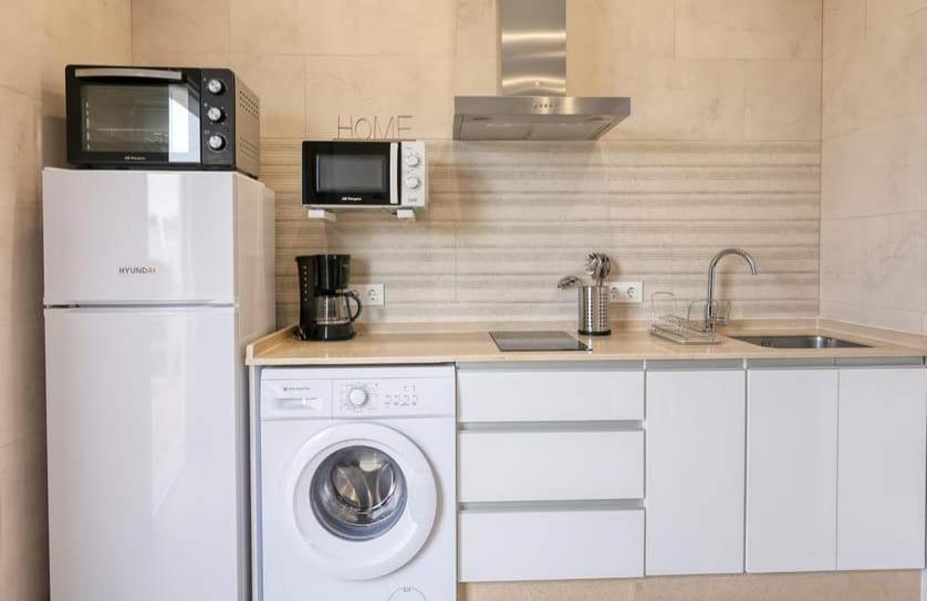 Kuchyňa alebo kuchynka v ubytovaní APARTAMENTO AMARÉ