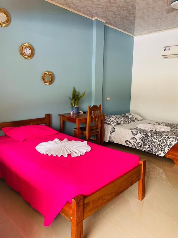 Postel nebo postele na pokoji v ubytování Hotel El Chaman