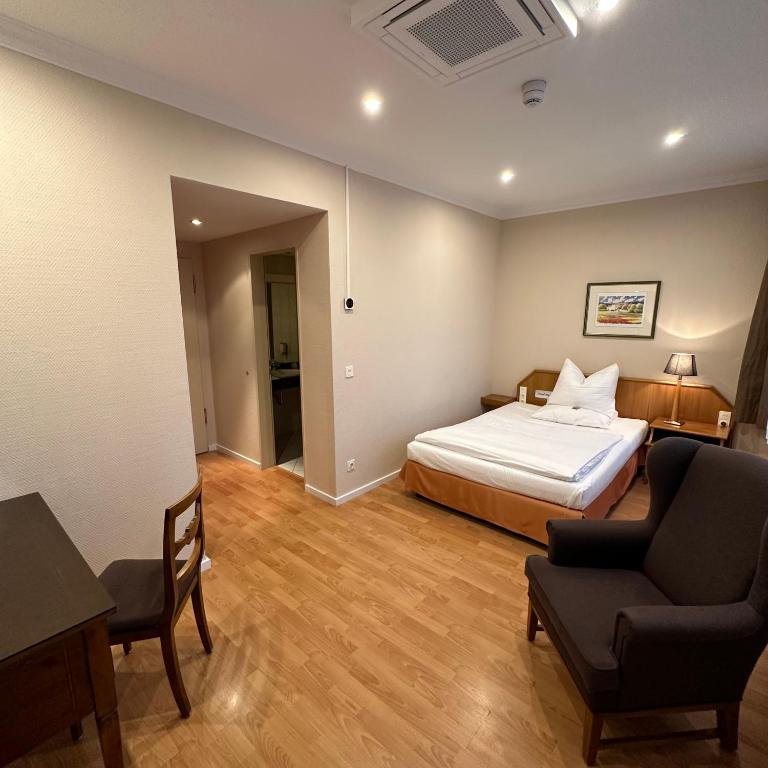 Postel nebo postele na pokoji v ubytování Hotel Ratswaage
