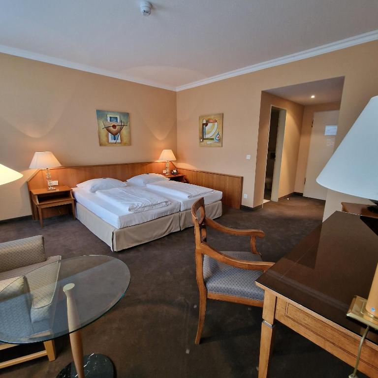Postel nebo postele na pokoji v ubytování Hotel Ratswaage