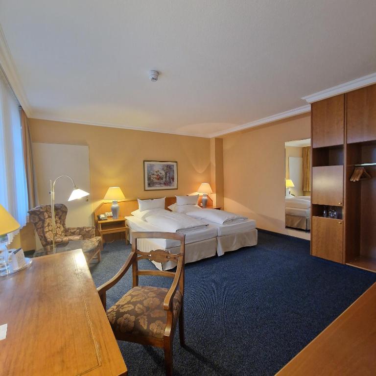 Postel nebo postele na pokoji v ubytování Hotel Ratswaage