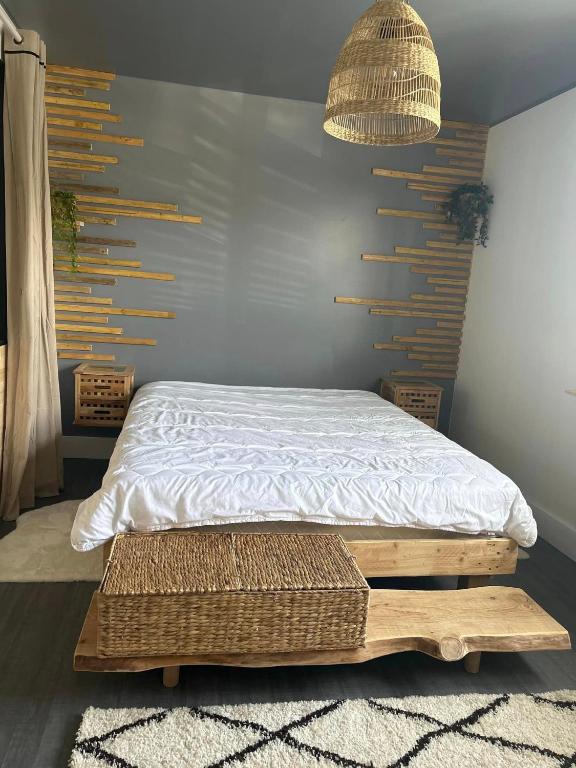 a bedroom with a bed on a wooden platform at La Salamandre de l Olivier - Le Laurier in Aubignosc