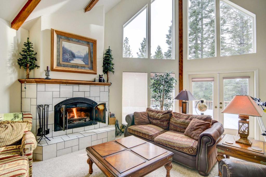 a living room with a couch and a fireplace at Pet-Friendly California Cabin with Beach Access in Chester